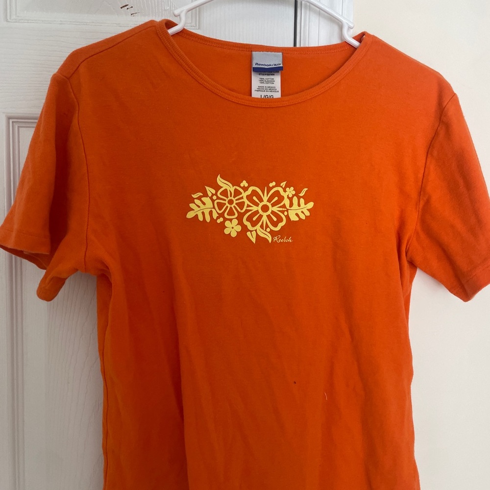 ORANGE TOP WITH FLOWERS SIZE LARGE